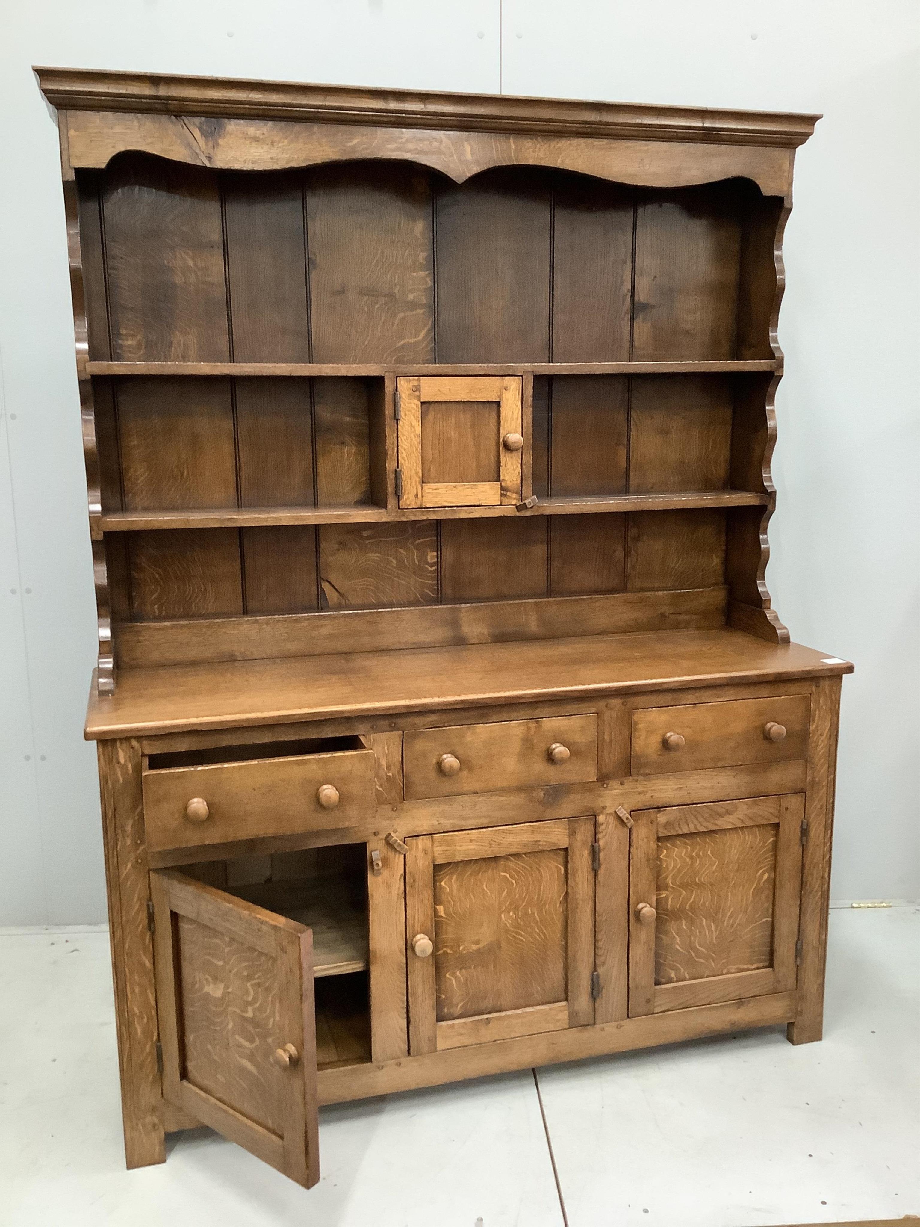 A near Contemporary 18th century style oak dresser, width 149cm, height 193cm. Condition - good